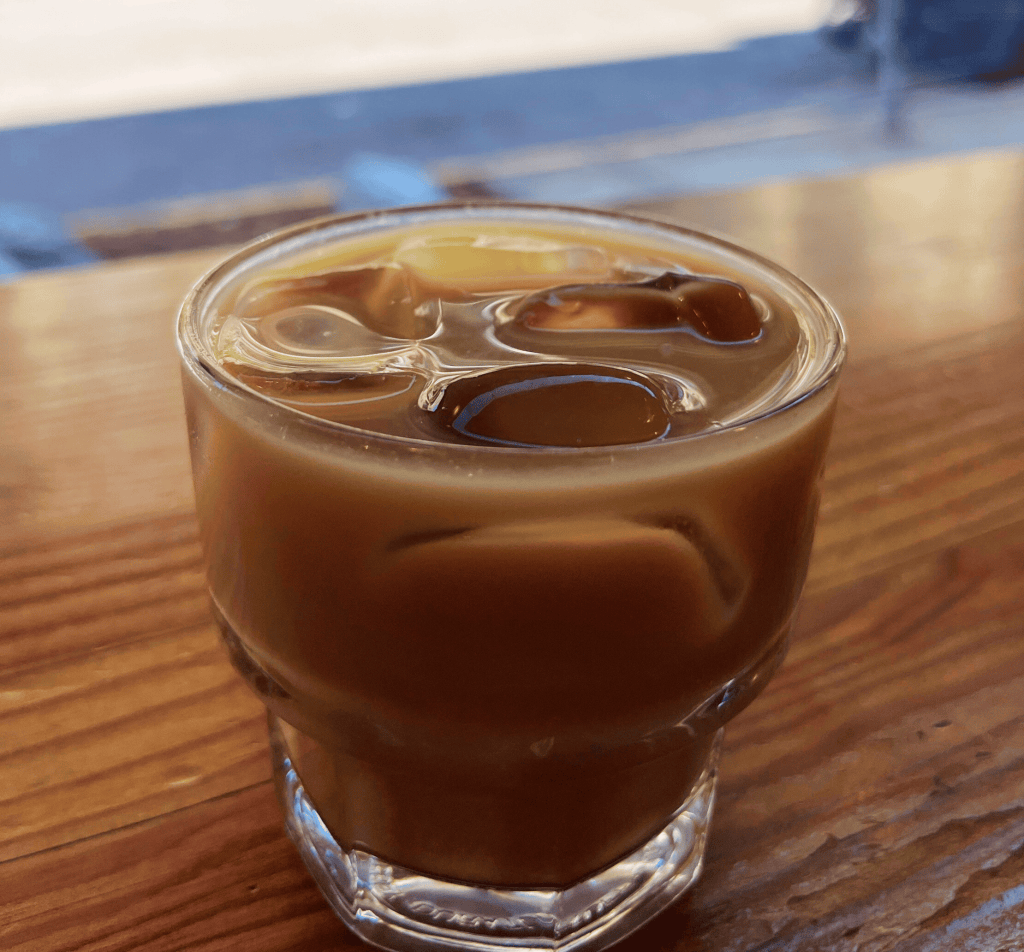 Short clear glass of iced coffee